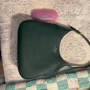 Dark green, Kate Spade bag.